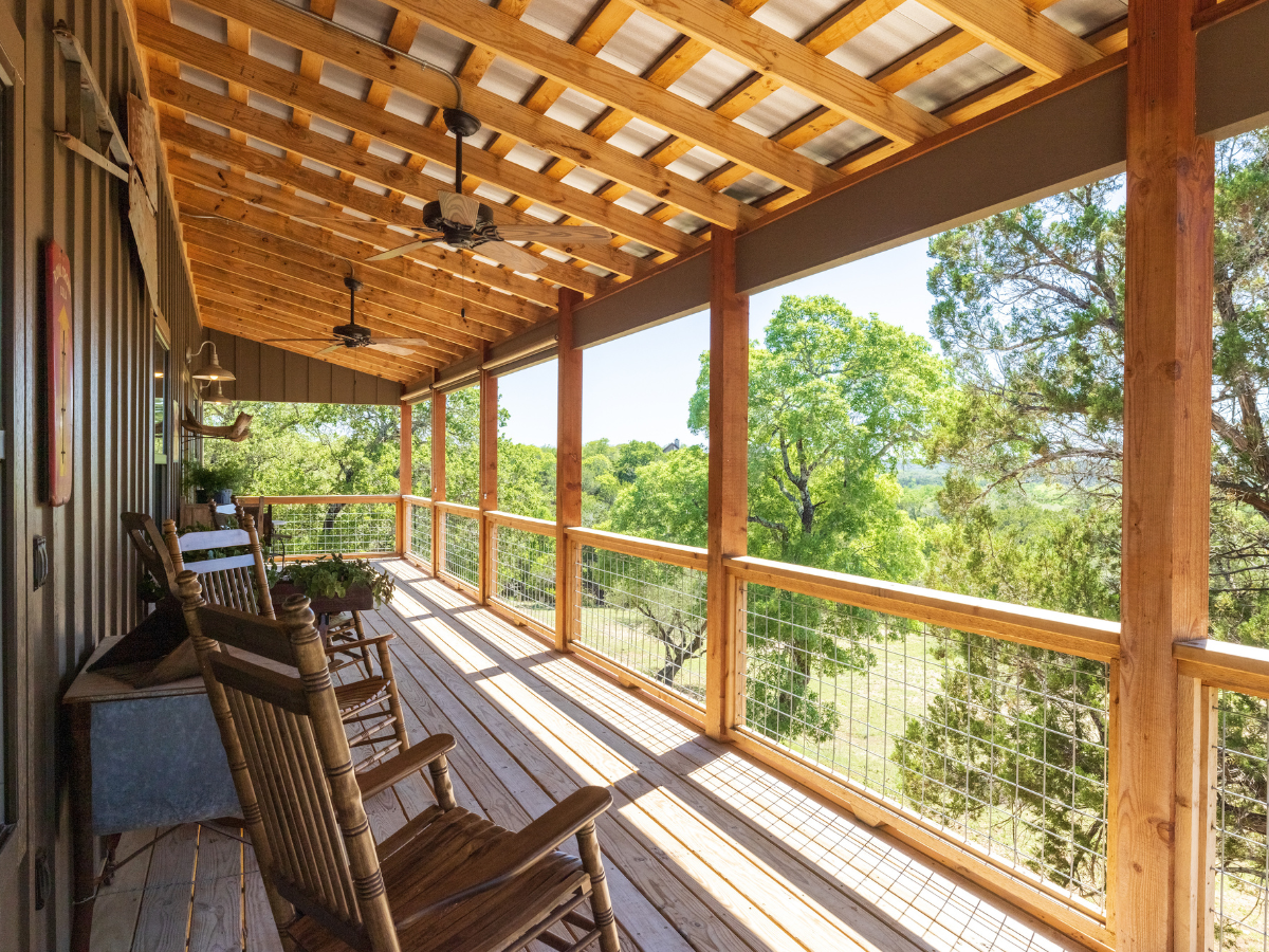 Image of Porch and rocking chairs at Texas Hill Country Hotel