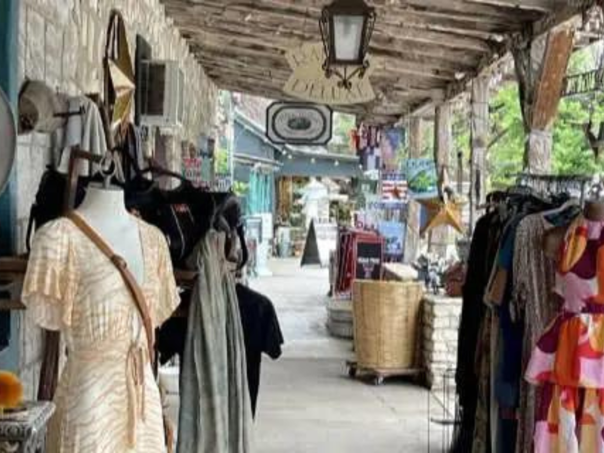image of patio walkway filled lined with dressings and retail shops in downtown Wimberley
