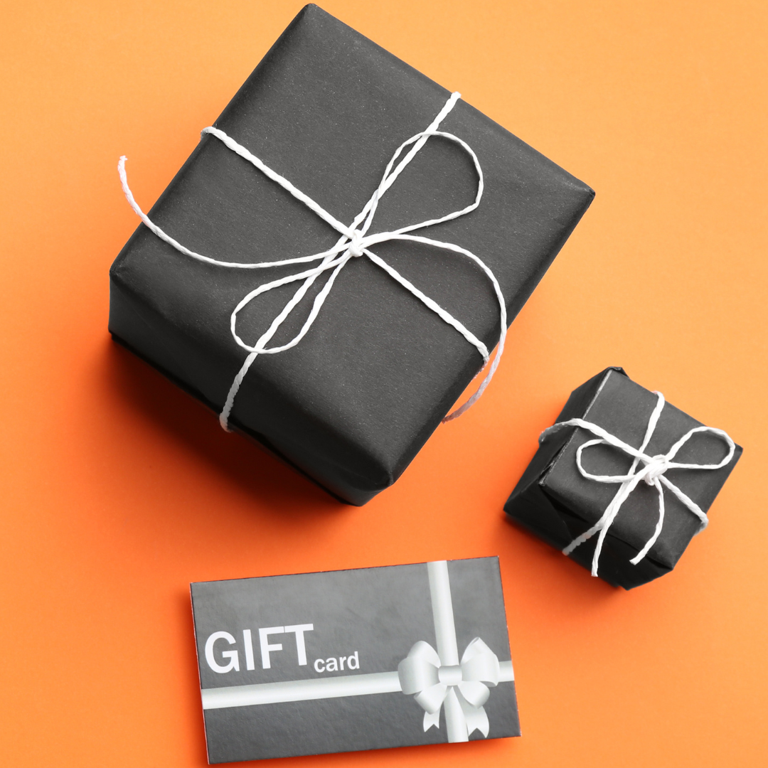Image of two black gift boxes with white ribbon and gift card