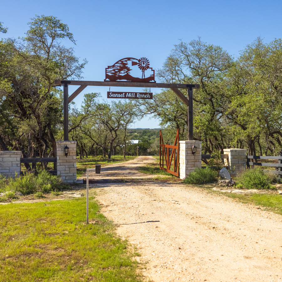 Image of gated entrance at Inn at Sunset Mill Ranch in Wimberley Texas