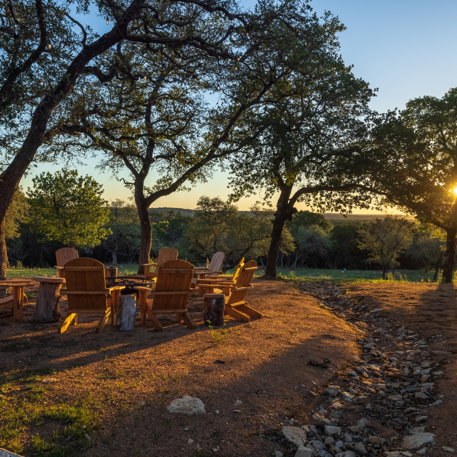 Image of adirondak chairs around firepit at Ranch in Texas Hill Country