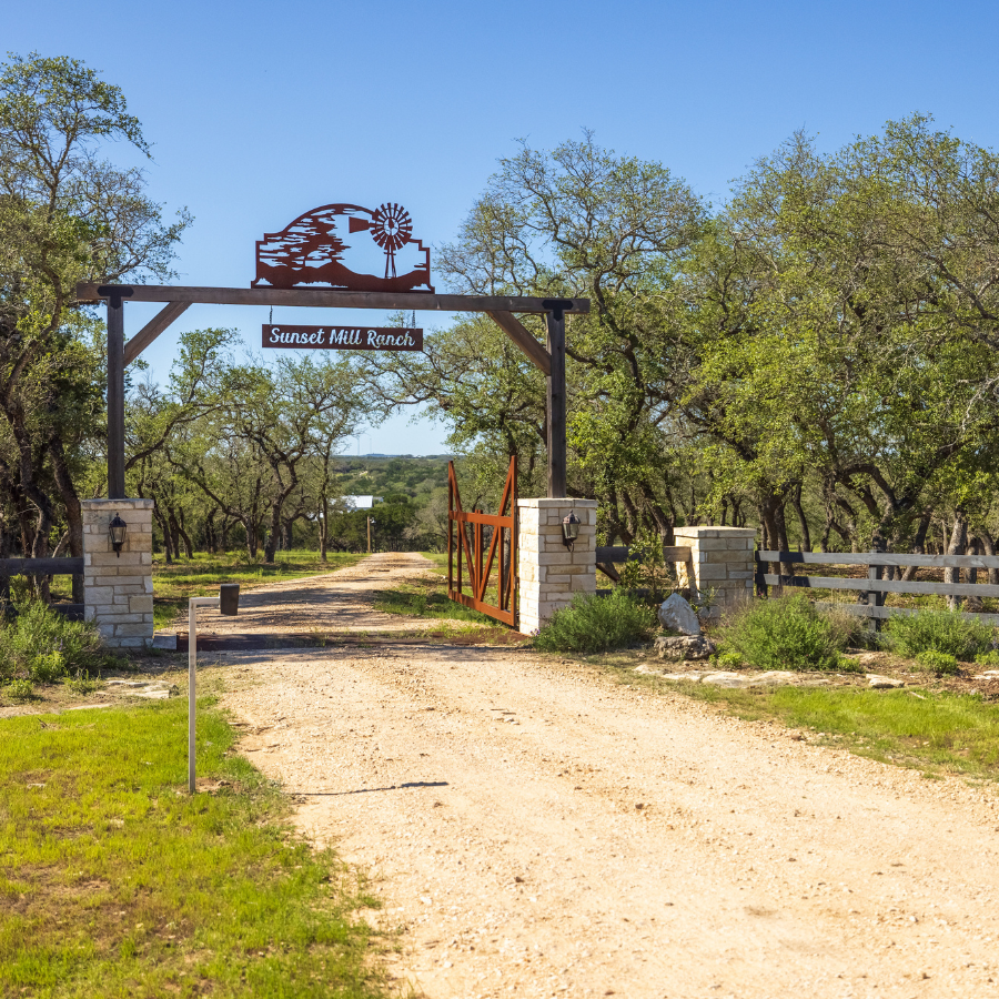 Image of gated entrance at Inn at Sunset Mill Ranch in Wimberley Texas