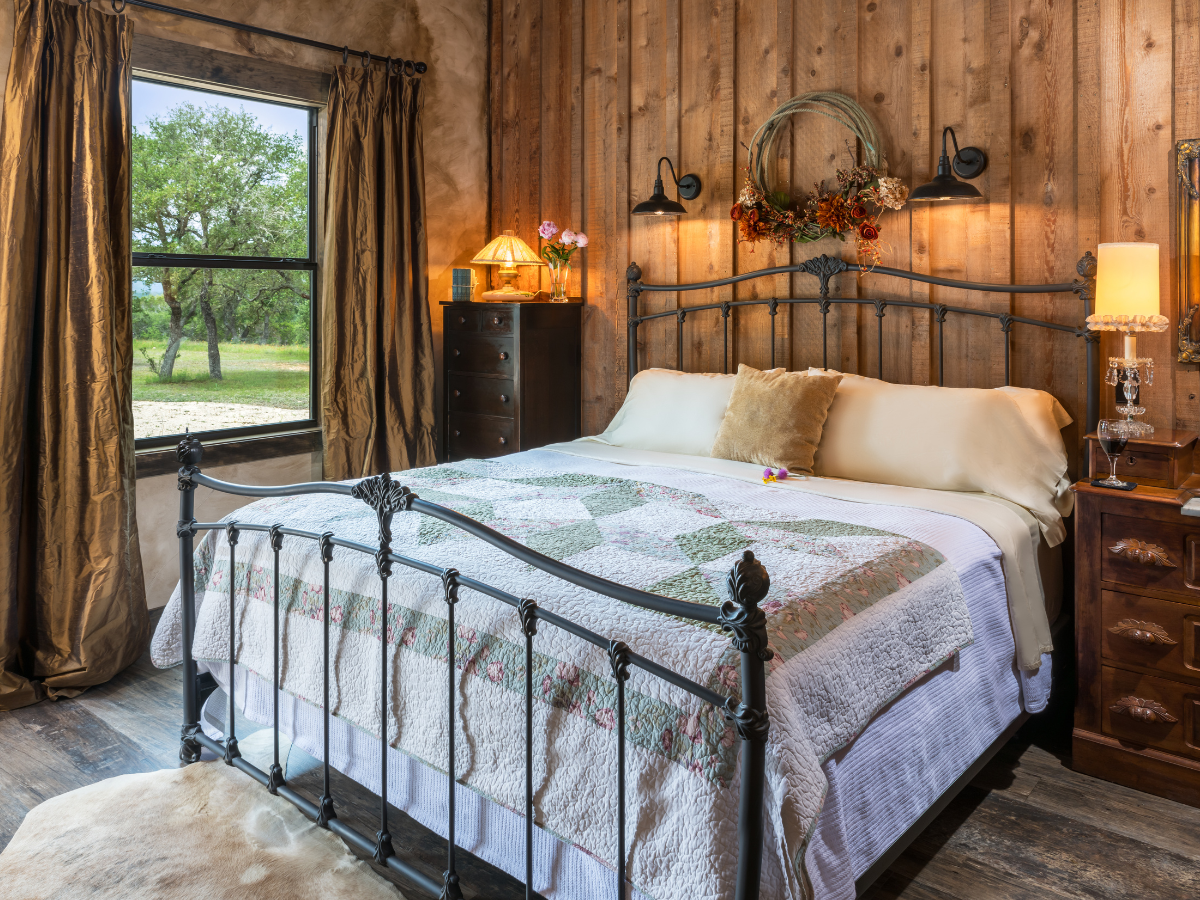 Image of king bed in hotel room in Texas hill country